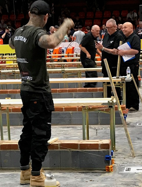 Bricklayer - Charlie Collison using MAGSY magnetic line block during Super Trowel bricklaying competition