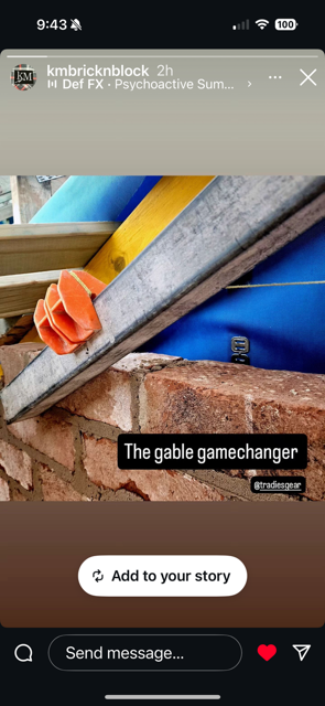 Close-up of a MAGSY line block on metal profile used for aligning bricks on a gable end