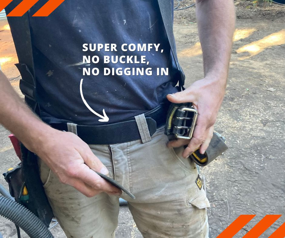 medium shot tradies gear no buckle belt under tools belt. Buckleless elastic belt suitable vegan belt