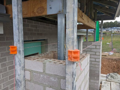 MAGSY magnetic line blocks holding string line on brick wall under construction